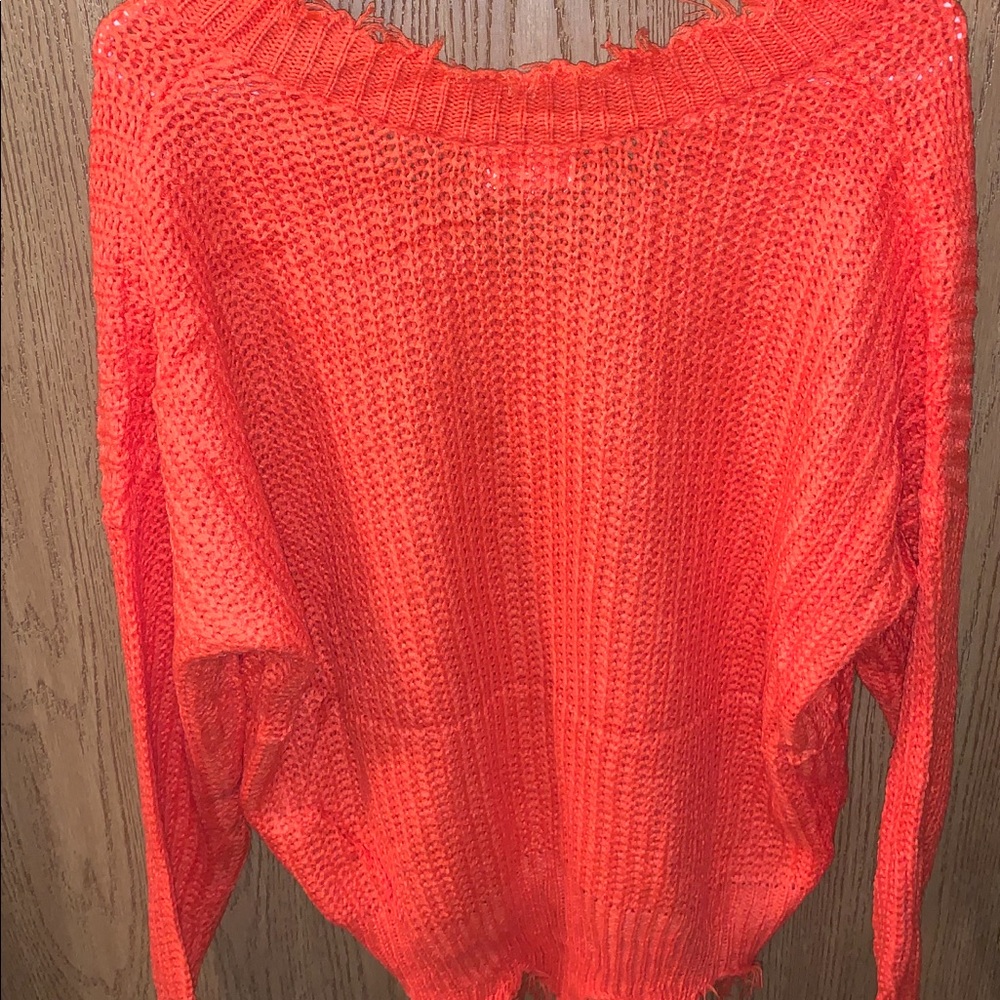 Fringed off the shoulder orange sweater